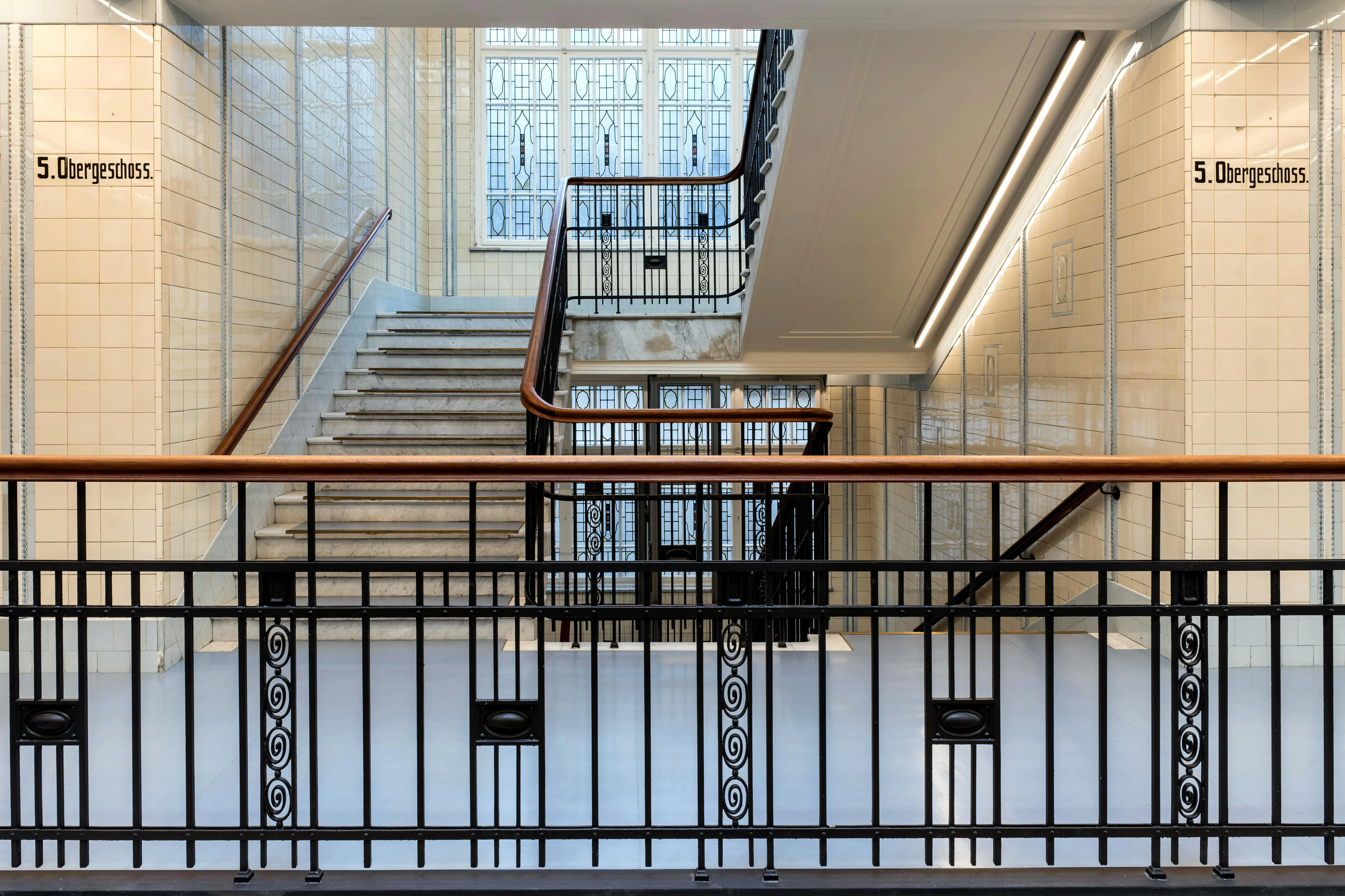 Handcrafted iron stair railing with artistic motifs 